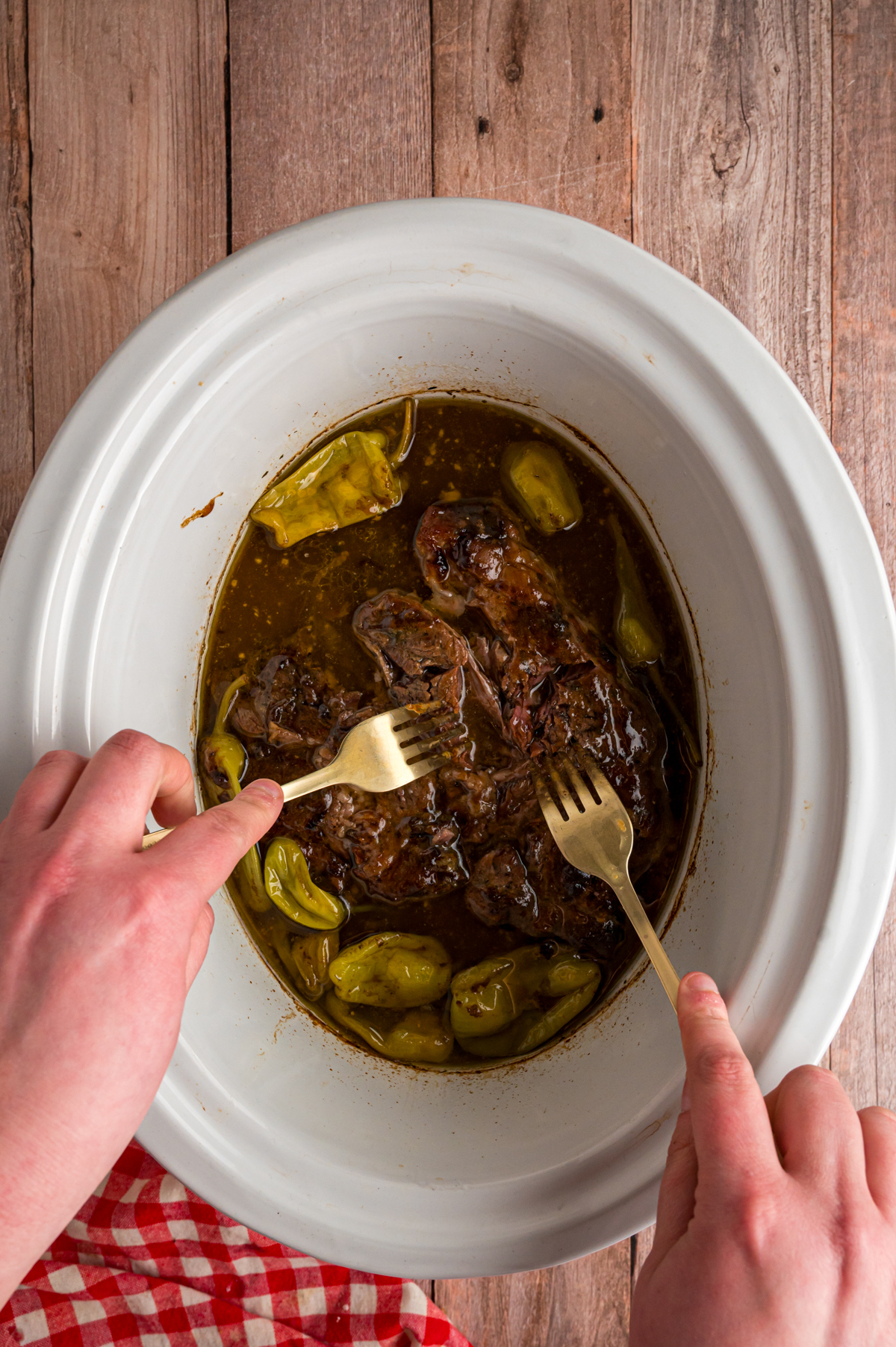 2 forks shredding mississippi pot roast.