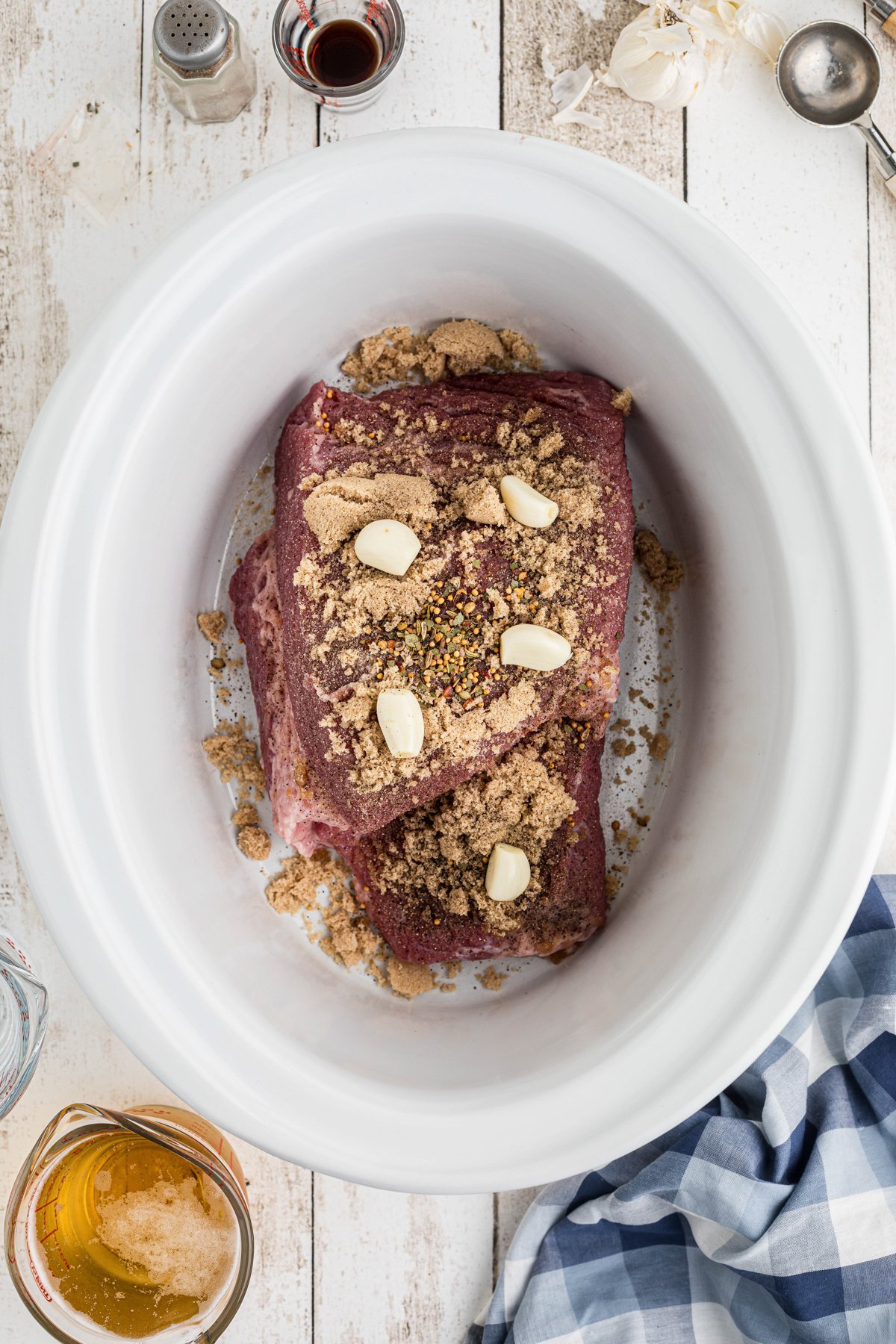 corned beef, garlic and seasonings in a slow cooker.