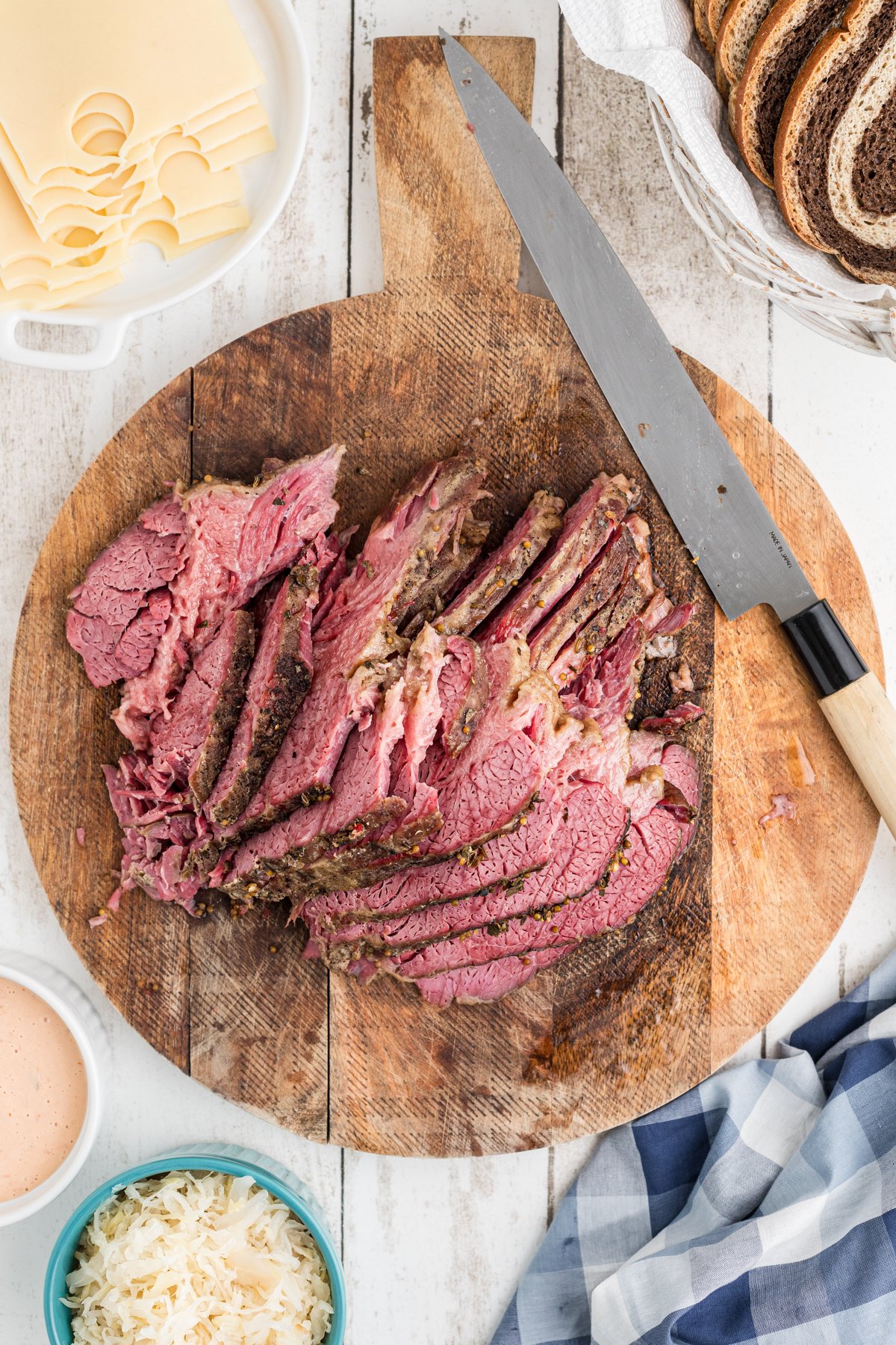 sliced pastrami on a cutting board.