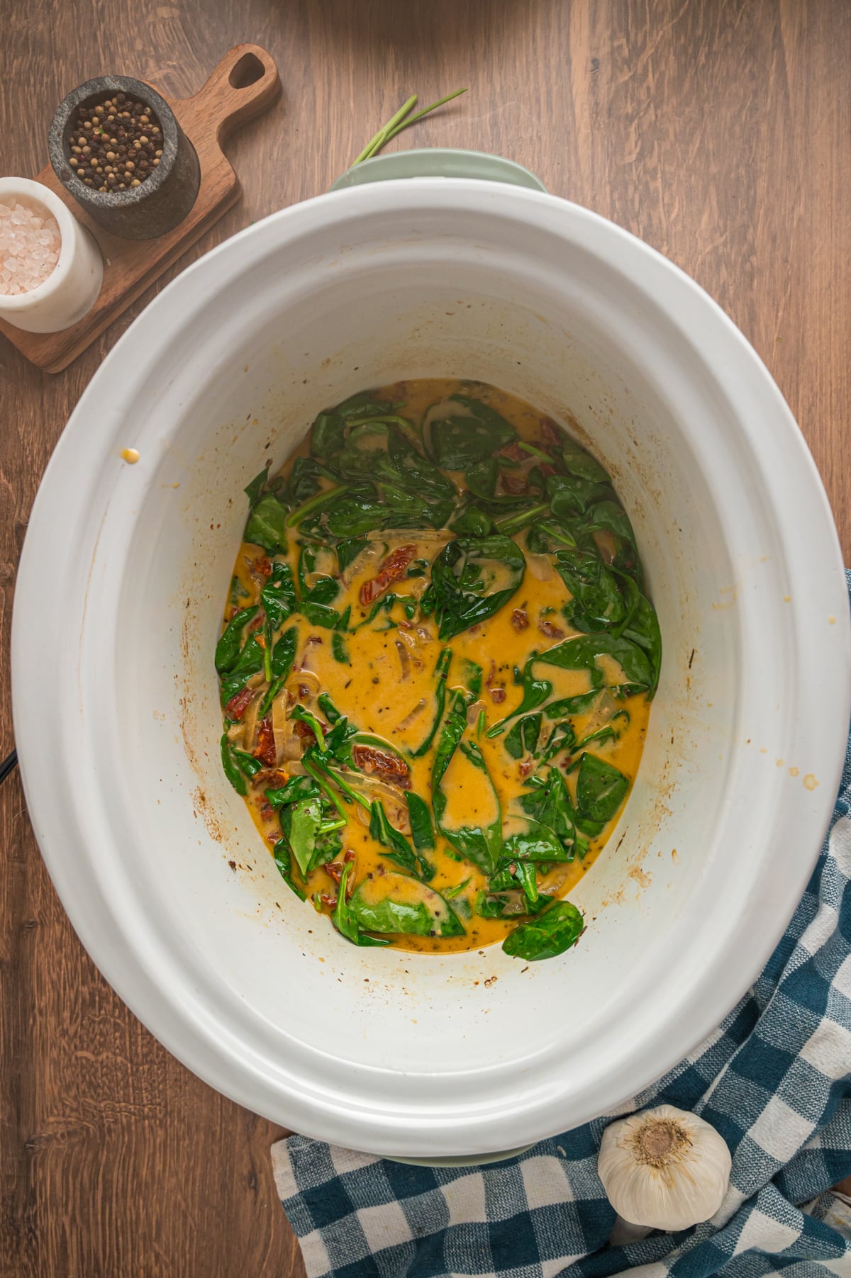 Cream added to tuscan chicken in the slow cooker.