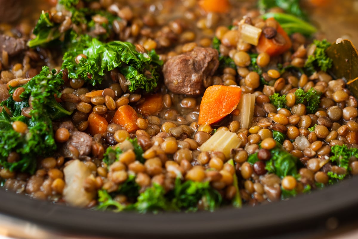 close-up of slow cooker beef and lentil soup.