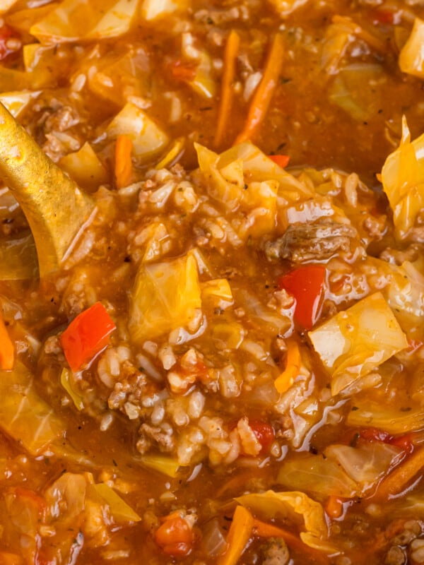 scooping out some slow cooker cabbage roll soup.