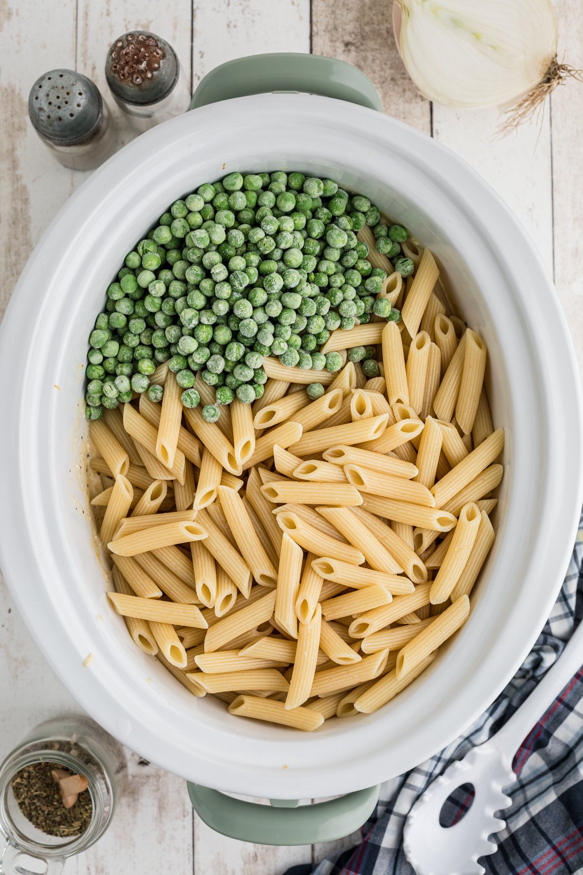 cooked pasta and peas added to the pasta and peas.