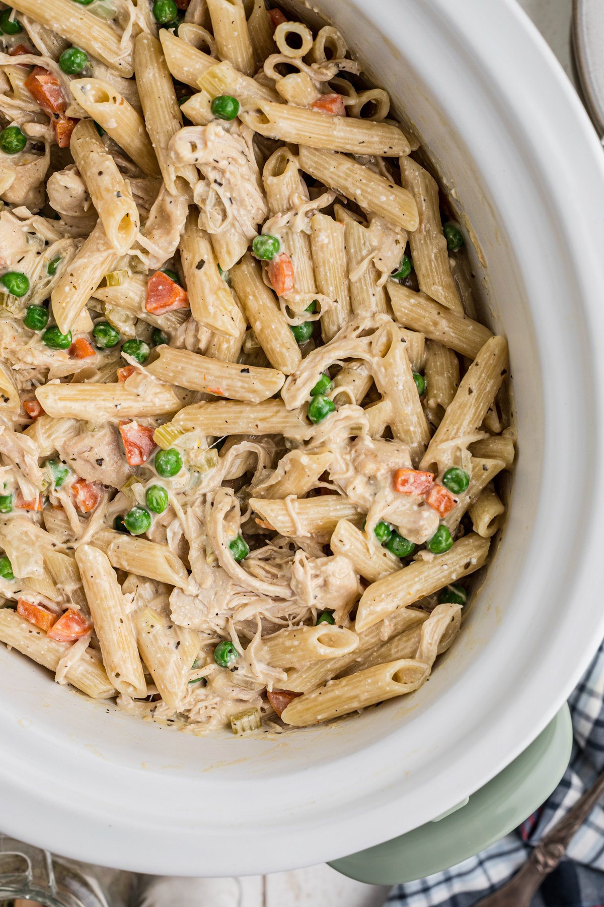 overhead shot of chicken pot pie pasta in a slow cooker.