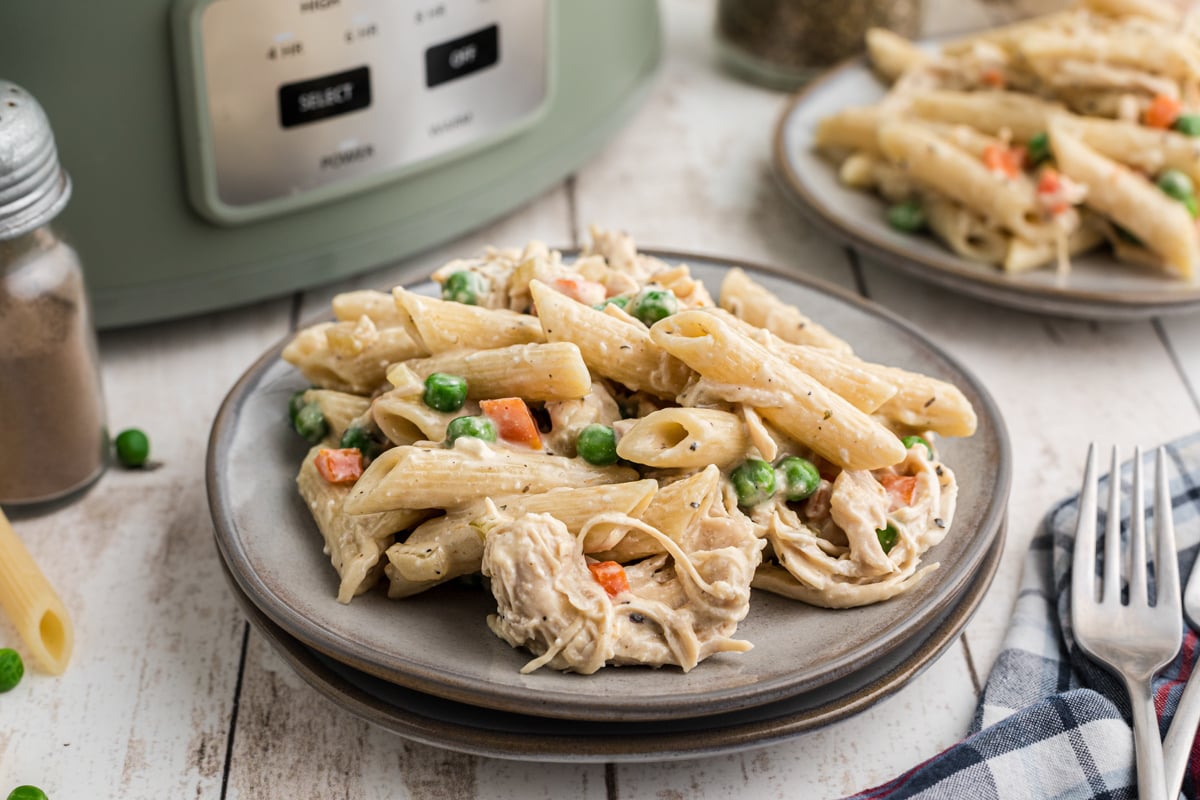 slow cooker chicken pot pie pasta on plates.