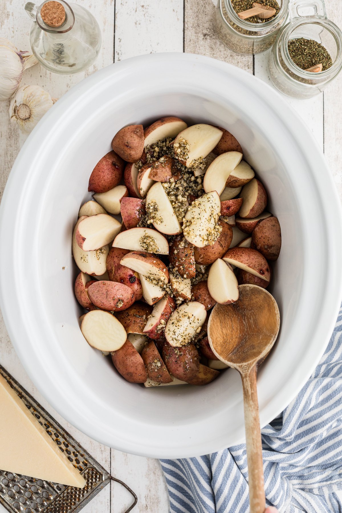Red potatoes with garlic mix over it.