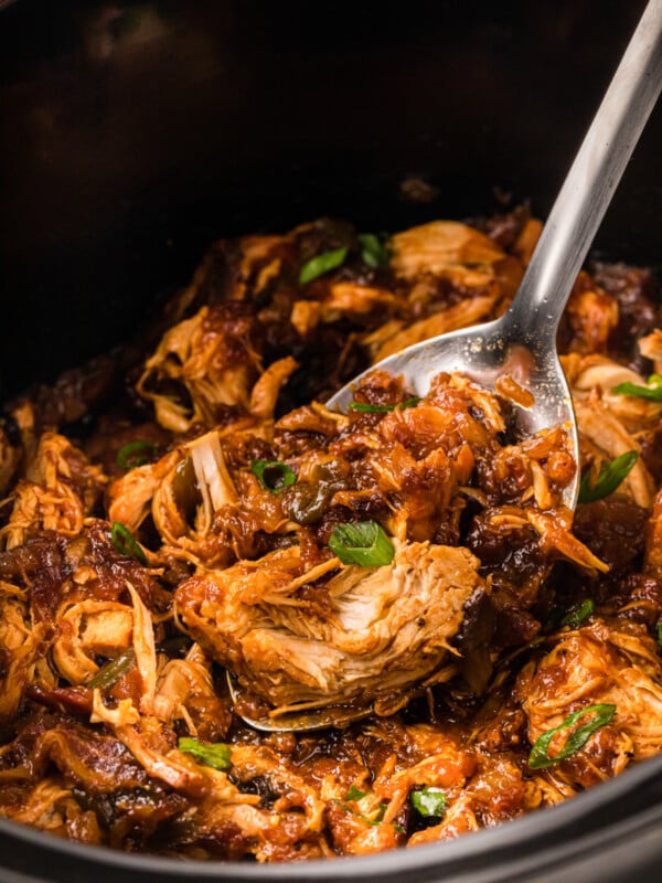 scooping out some slow cooker hawaiian chicken.