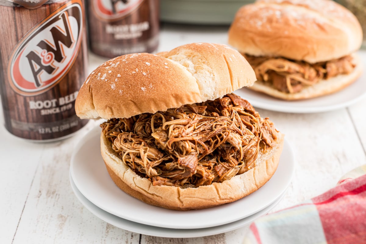 serving of slow cooker root beer chicken on a bun.
