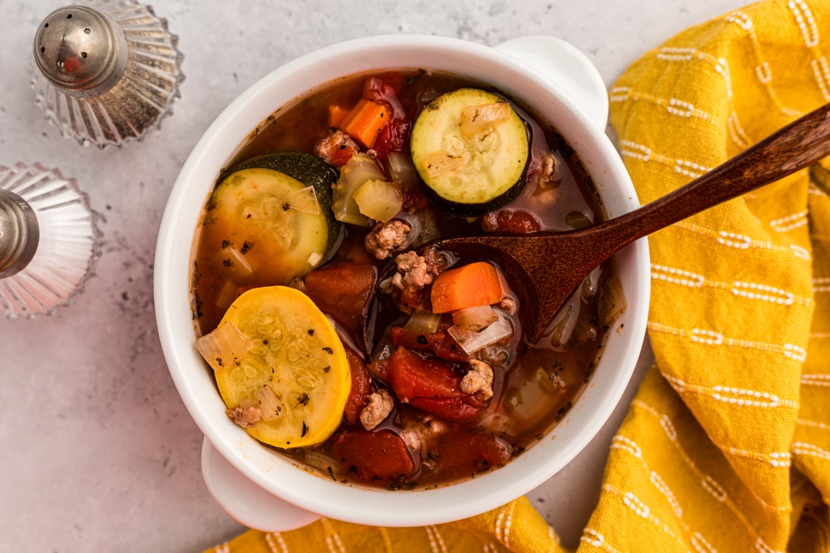 overhead shot of slow cooker zucchini soup in a bowl.