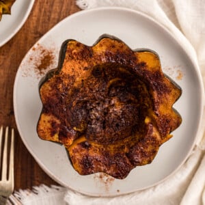 overhead shot of slow cooker acorn squash half on a plate.