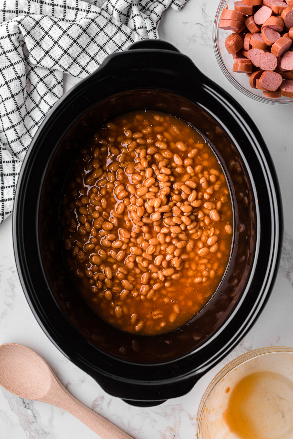 canned pork and beans in a slow cooker.