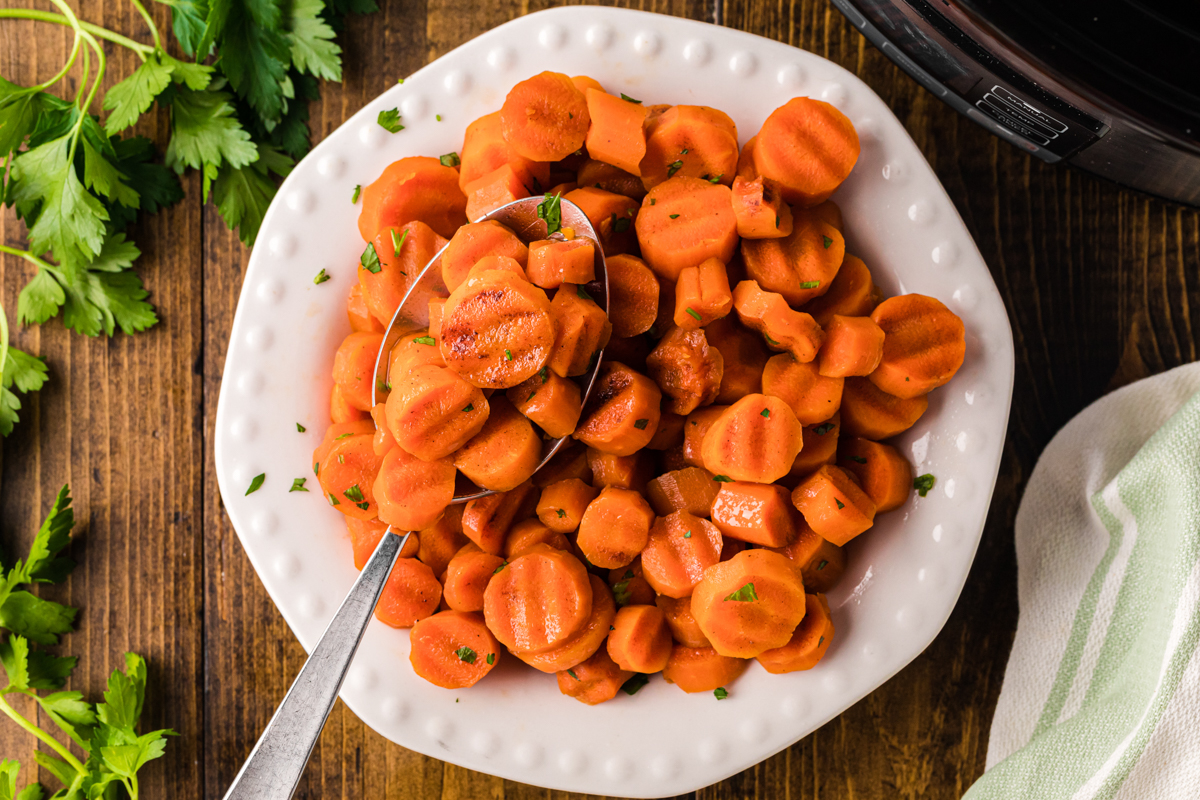 overhead shot of serving of slow cooker candied carrots on a plate.