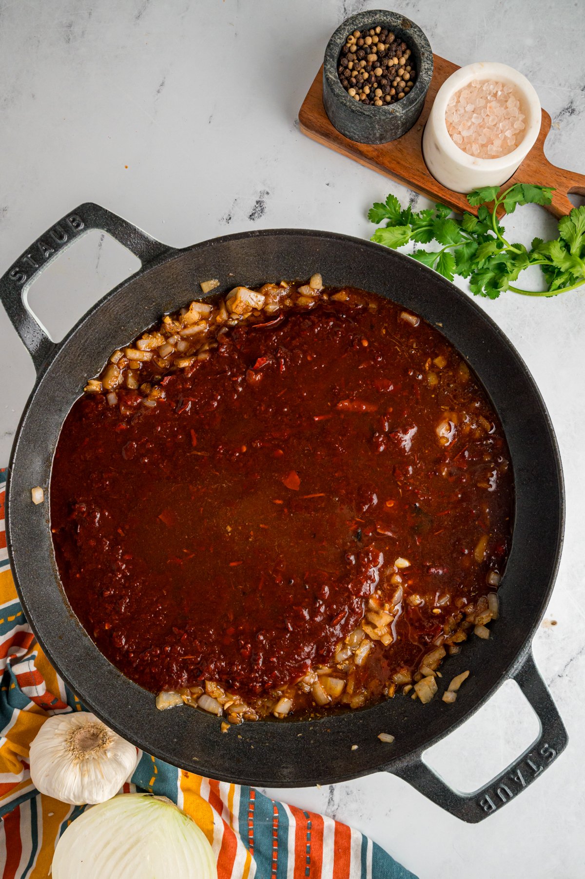 onion, garlic, chili mixture, and seasonings in a skillet.