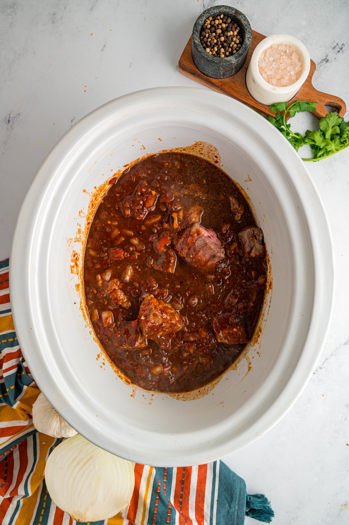 ingredients for slow cooker chile colorado in a crockpot.
