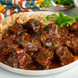 close-up of a serving of slow cooker chile colorado on a plate.