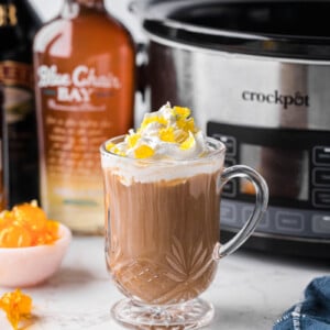 A mug filled with slow cooker hot buttered rum coffee.