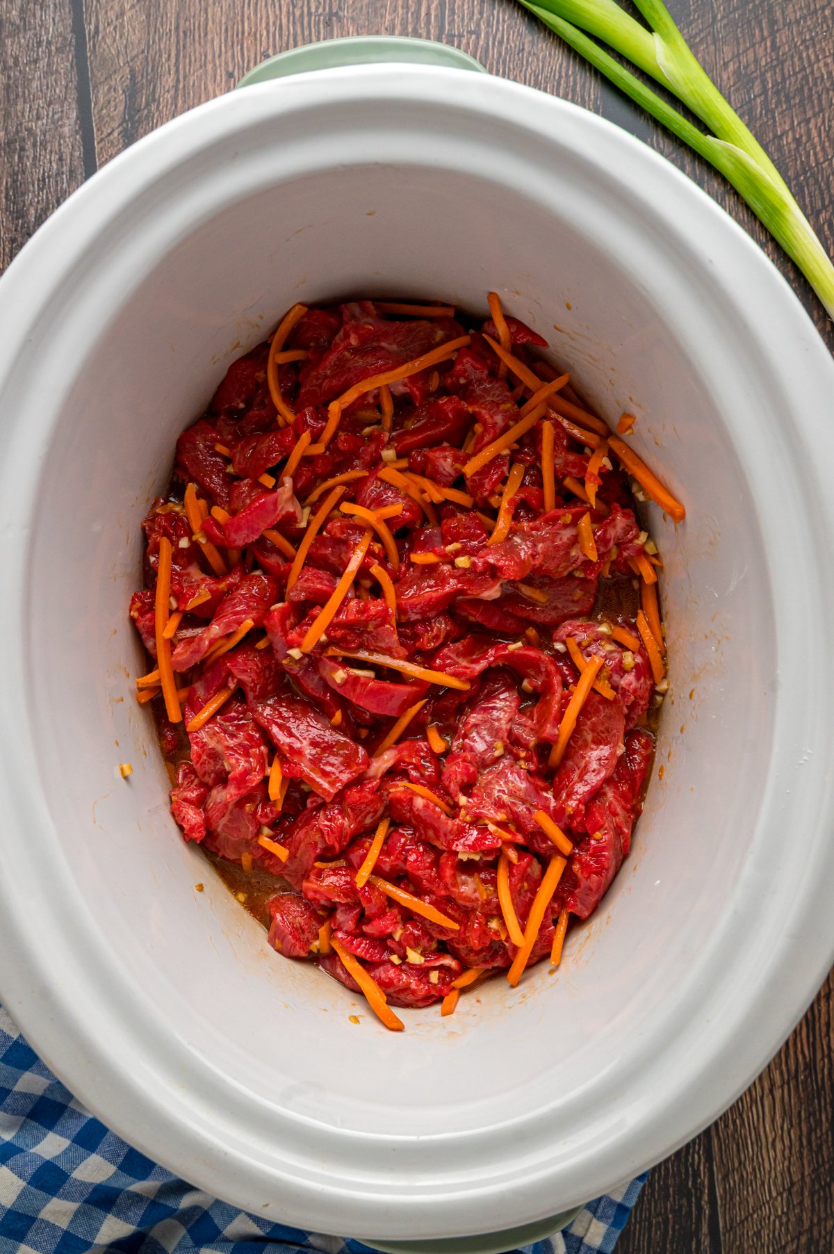 flank steak, carrots, and sauce stirred together.