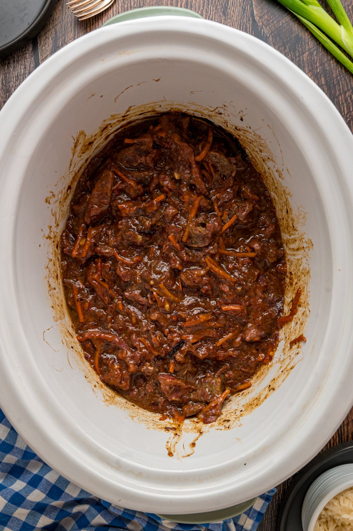 slow cooker mongolian beef in a crockpot after cooking.