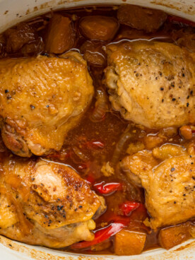 close-up overhead of slow cooker pineapple chicken in a crockpot.