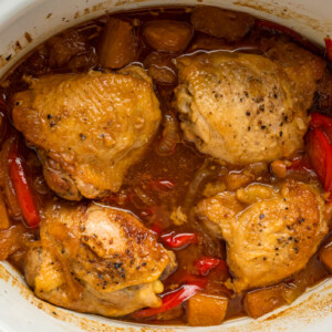 close-up overhead of slow cooker pineapple chicken in a crockpot.