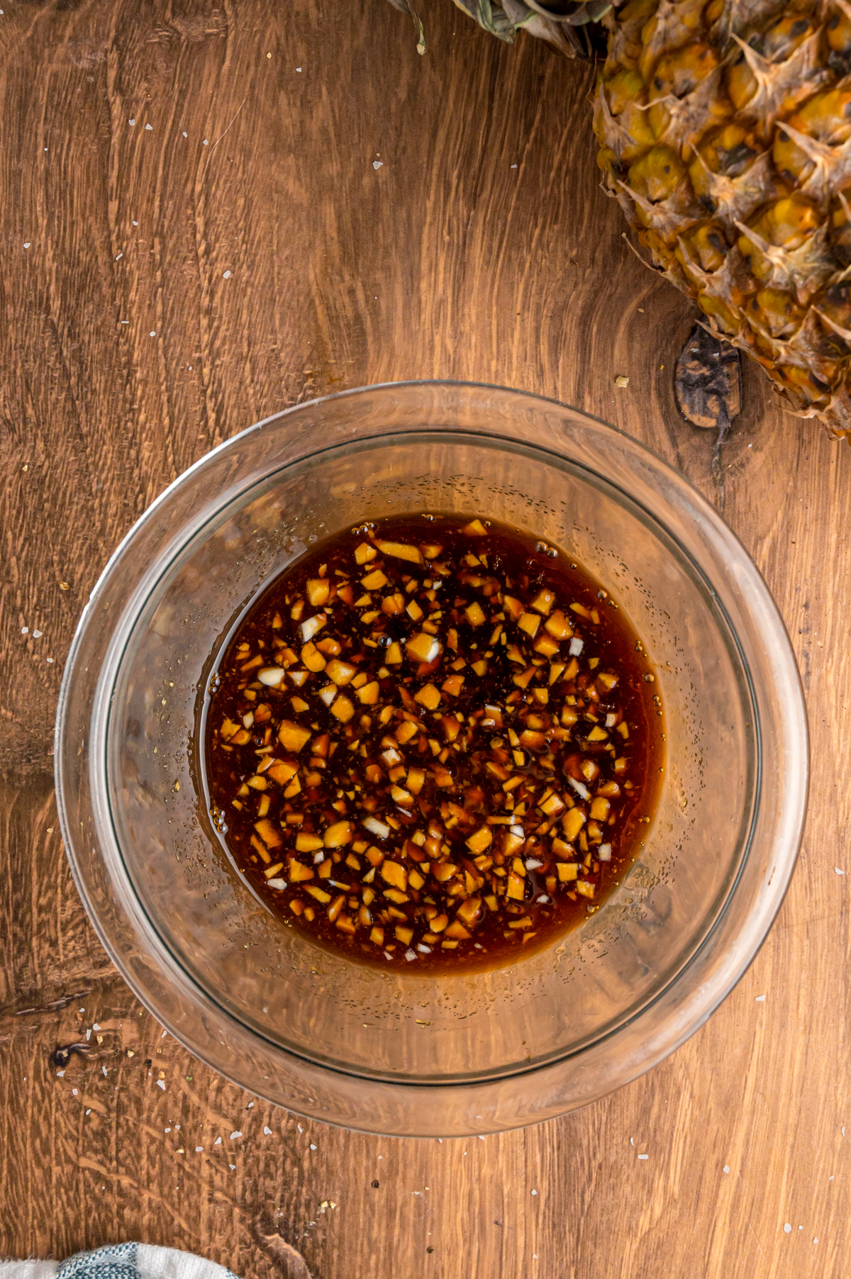slow cooker pineapple chicken sauce ingredients mixed together in a bowl.