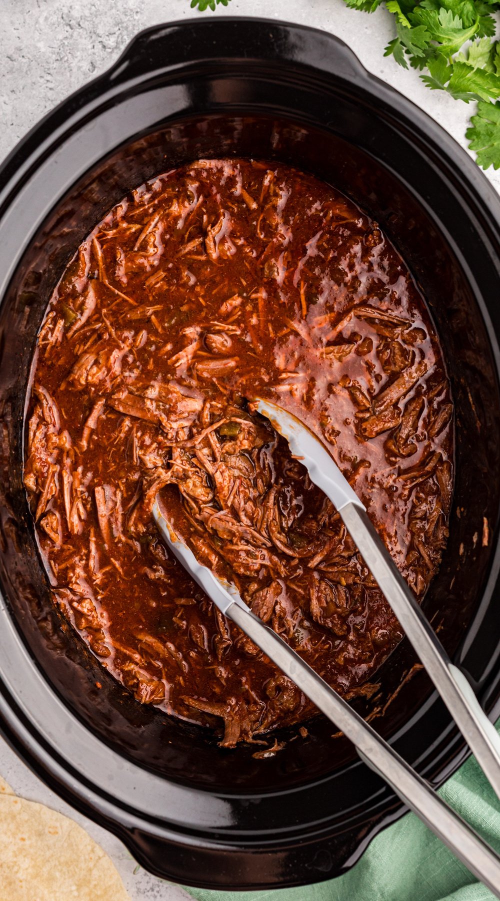 Long image of slow cooker salsa beef.