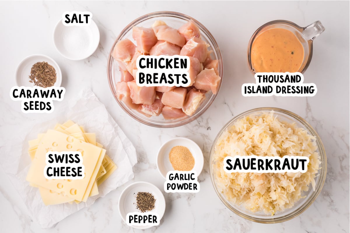 Ingredients for slow cooker chicken reuben casserole on a table.