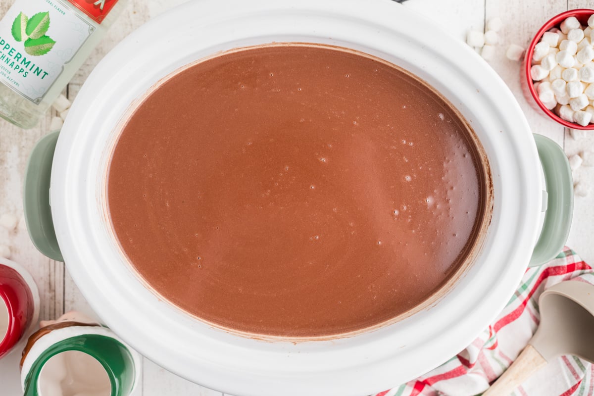 Slow cooker filled with boozy hot chocolate.