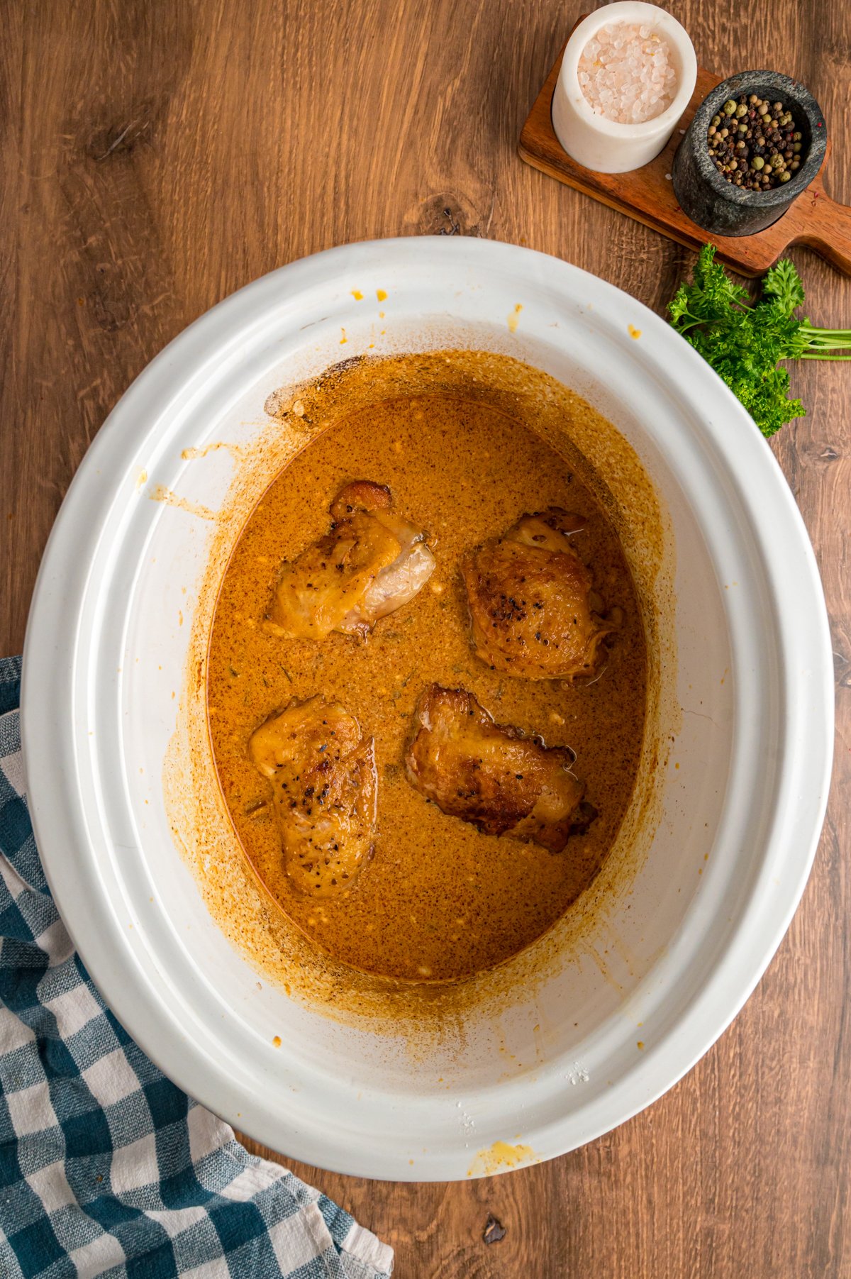 Slow cooker chicken paprika in a crockpot after cooking.