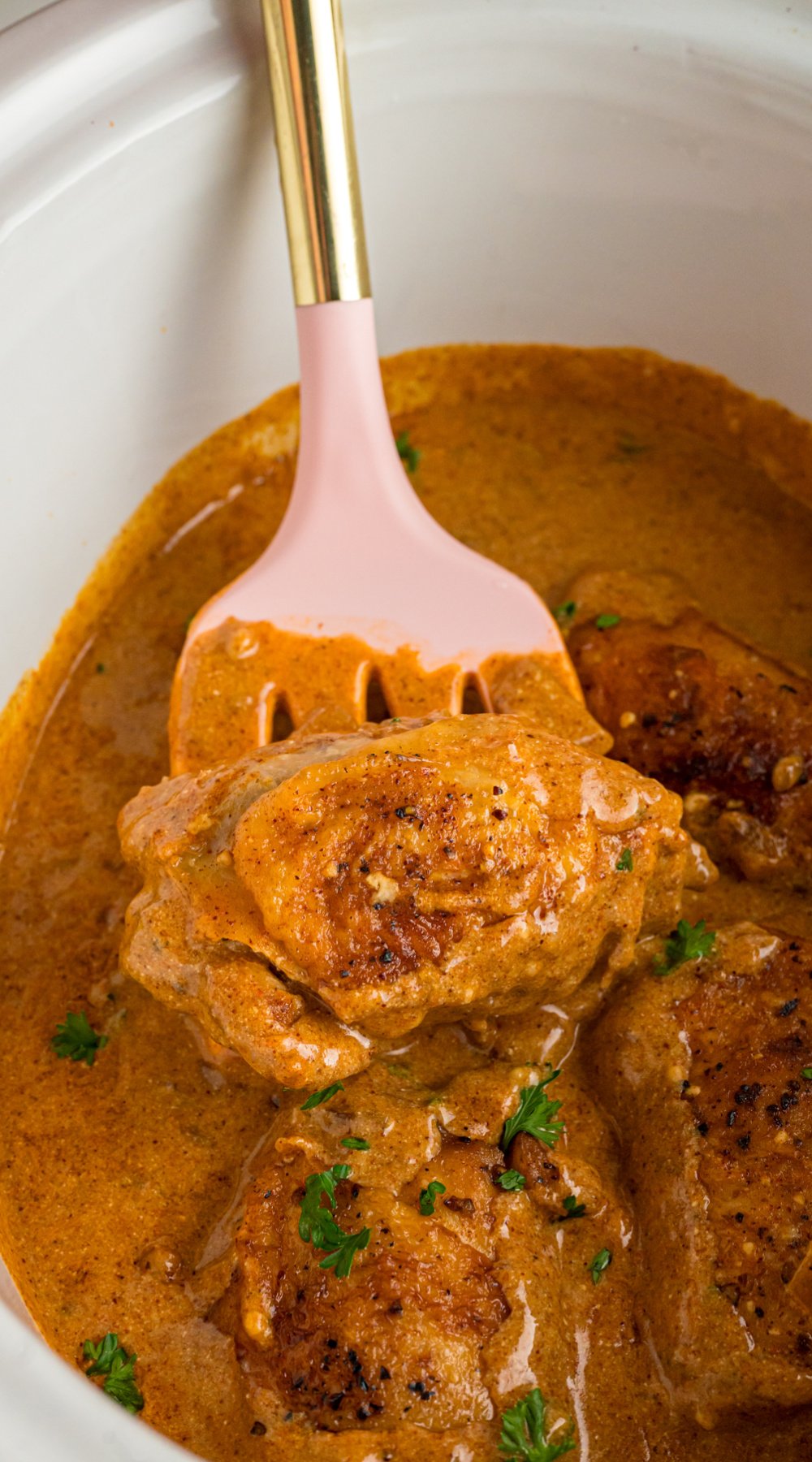 Long image of slow cooker chicken paprika.