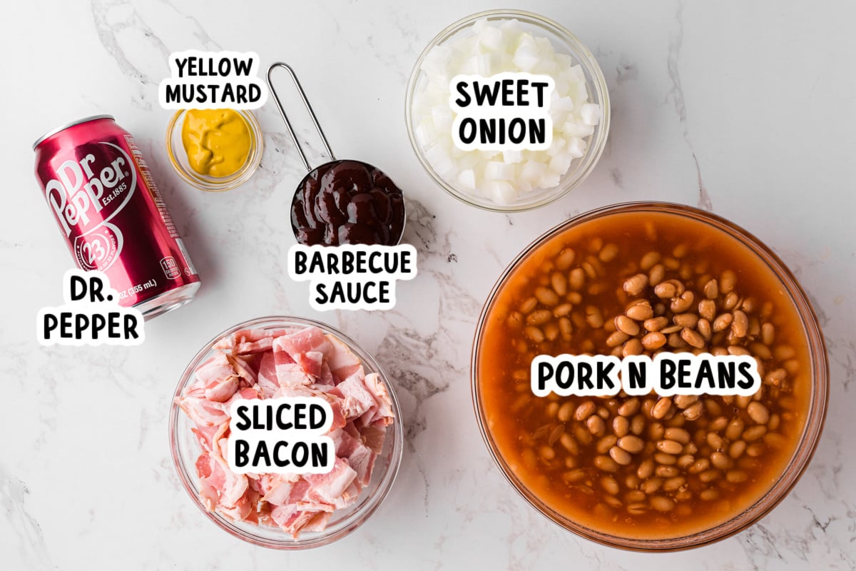 ingredients for slow cooker dr. pepper baked beans  on a table.