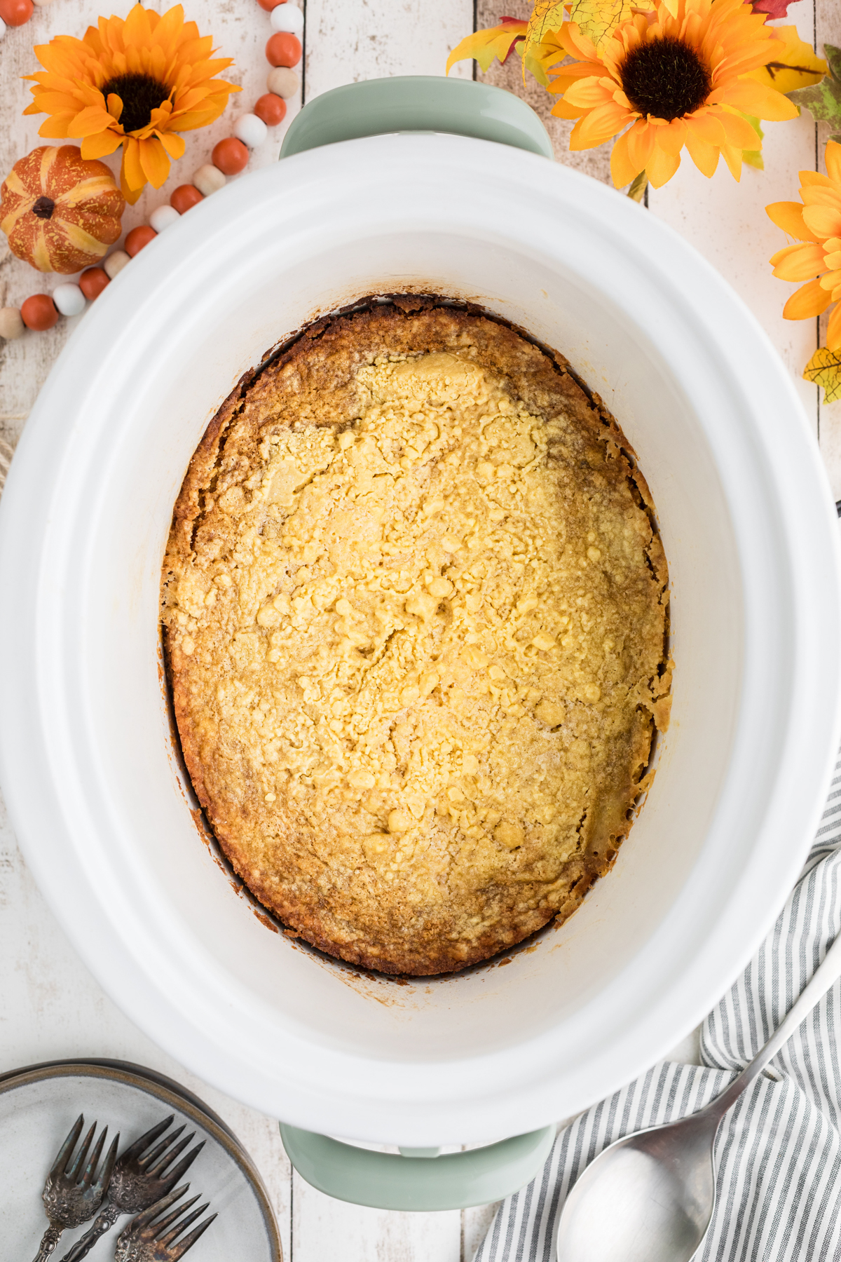 Slow cooker pumpkin cobbler in a crockpot after cooking.