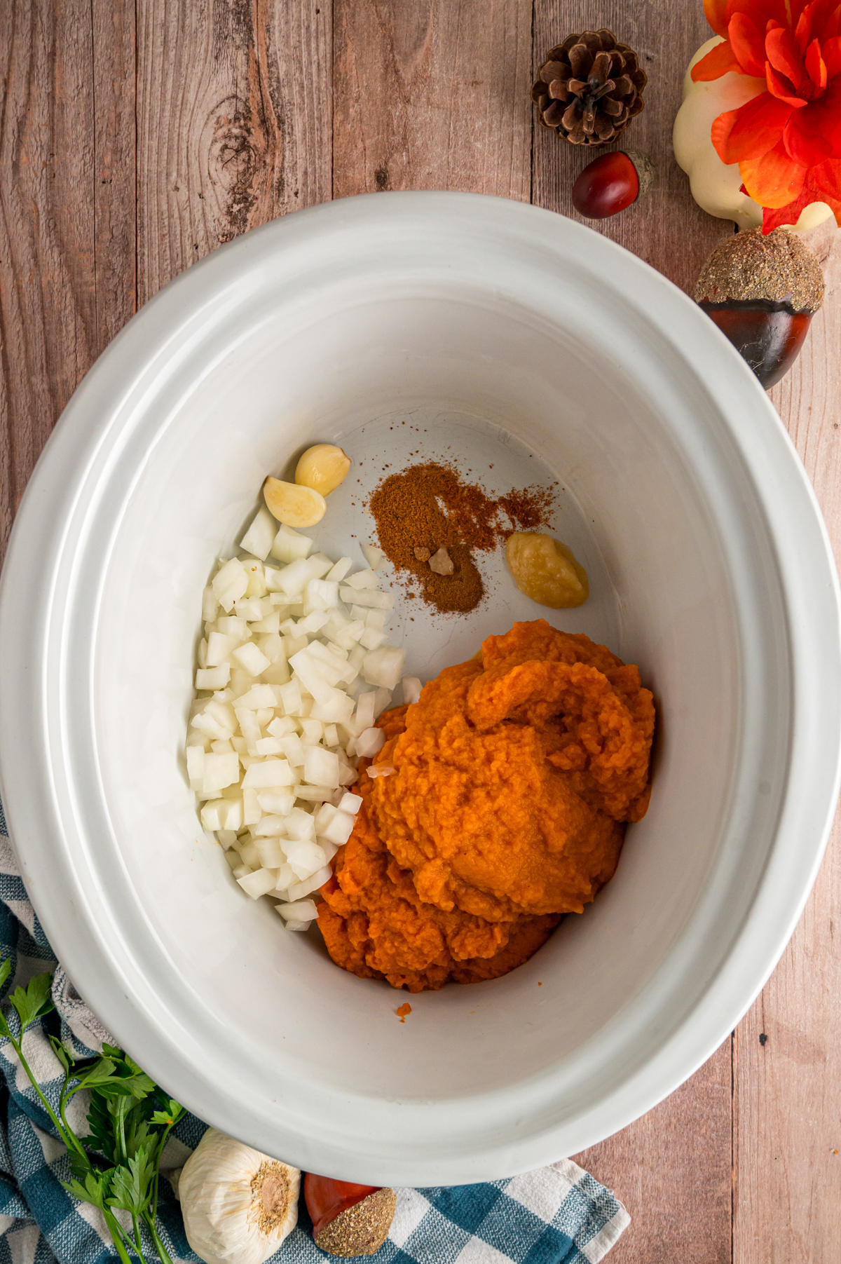 pumpkin puree, onion, garlic, ginger paste, and seasonings in a crockpot.