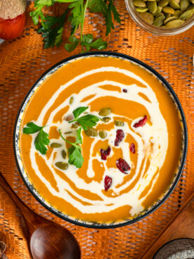 Serving of slow cooker pumpkin soup in a bowl.