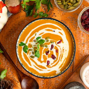 Serving of slow cooker pumpkin soup in a bowl.