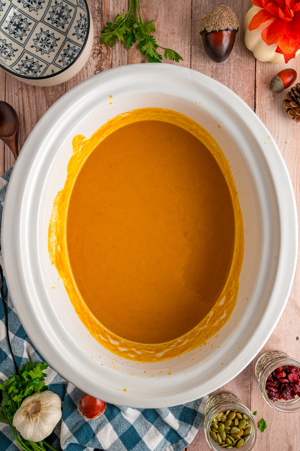 Slow cooker pumpkin soup after coconut milk was added in.