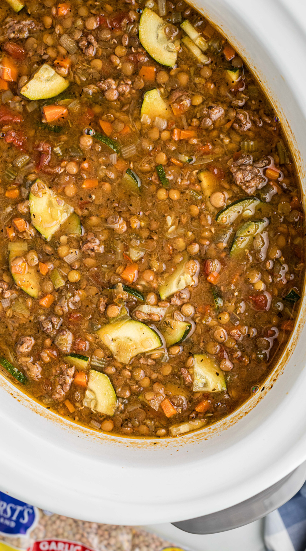 Long image of slow cooker sausage lentil soup.