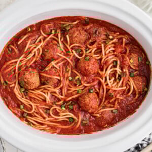 Slow cooker spaghetti and meatballs in a crockpot after cooking.