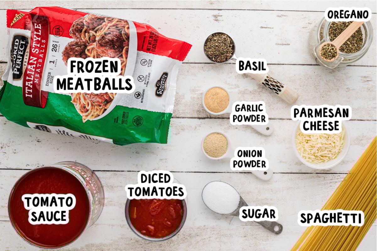 Ingredients for slow cooker spaghetti and meatballs on a table.