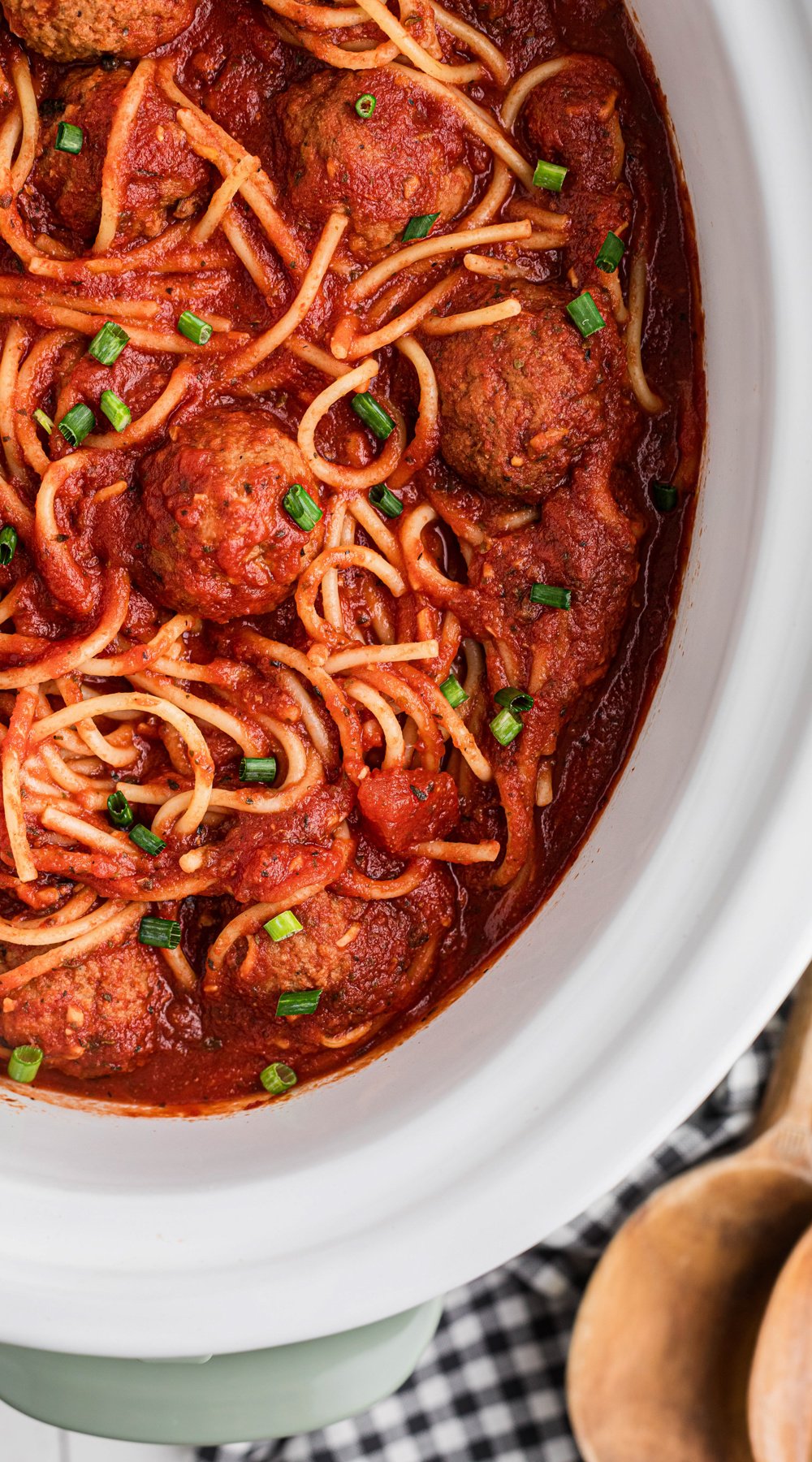 Long image of slow cooker spaghetti and meatballs.