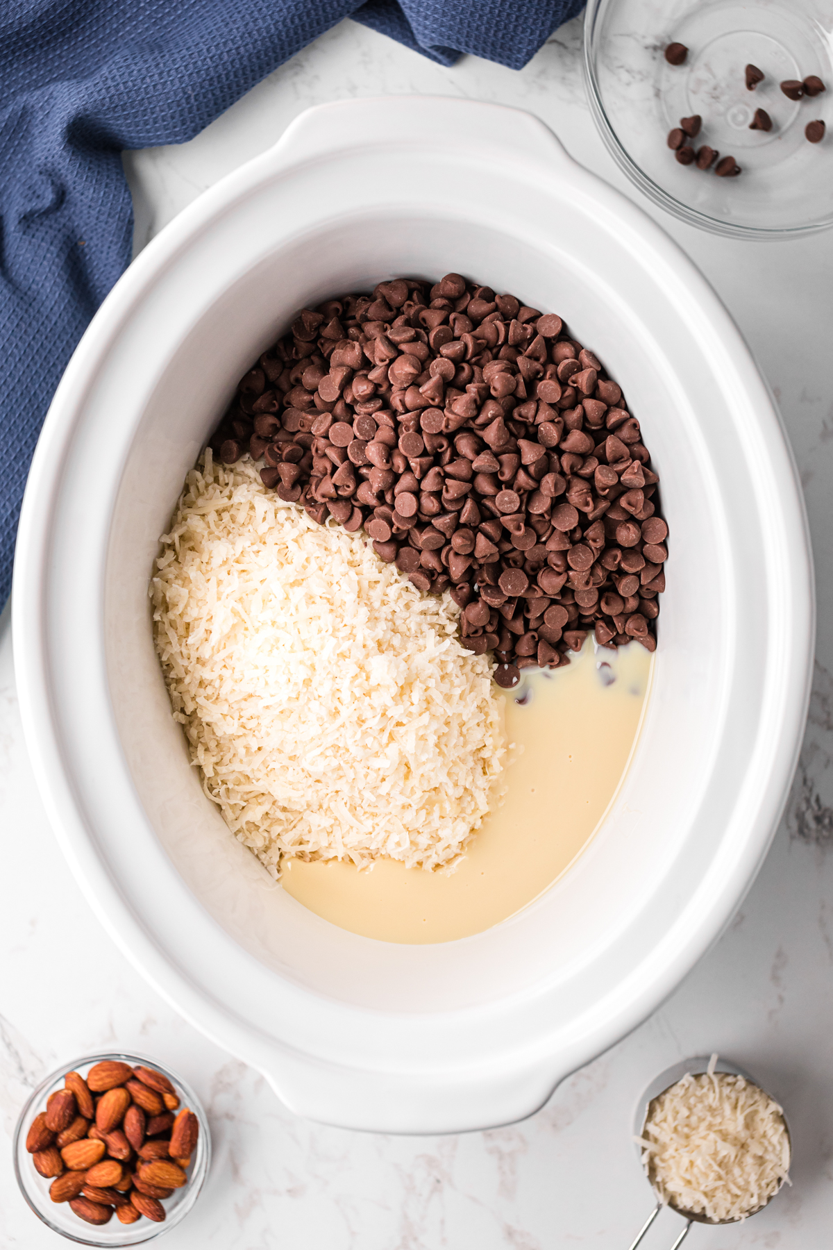 Ingredients for almond joys in a slow cooker.