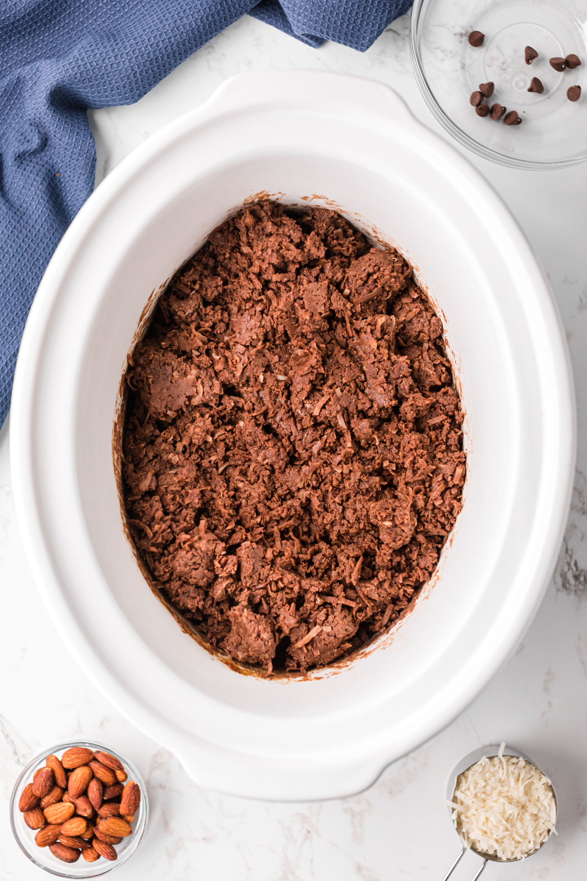 Almond joy mixture after cooking in a crockpot.