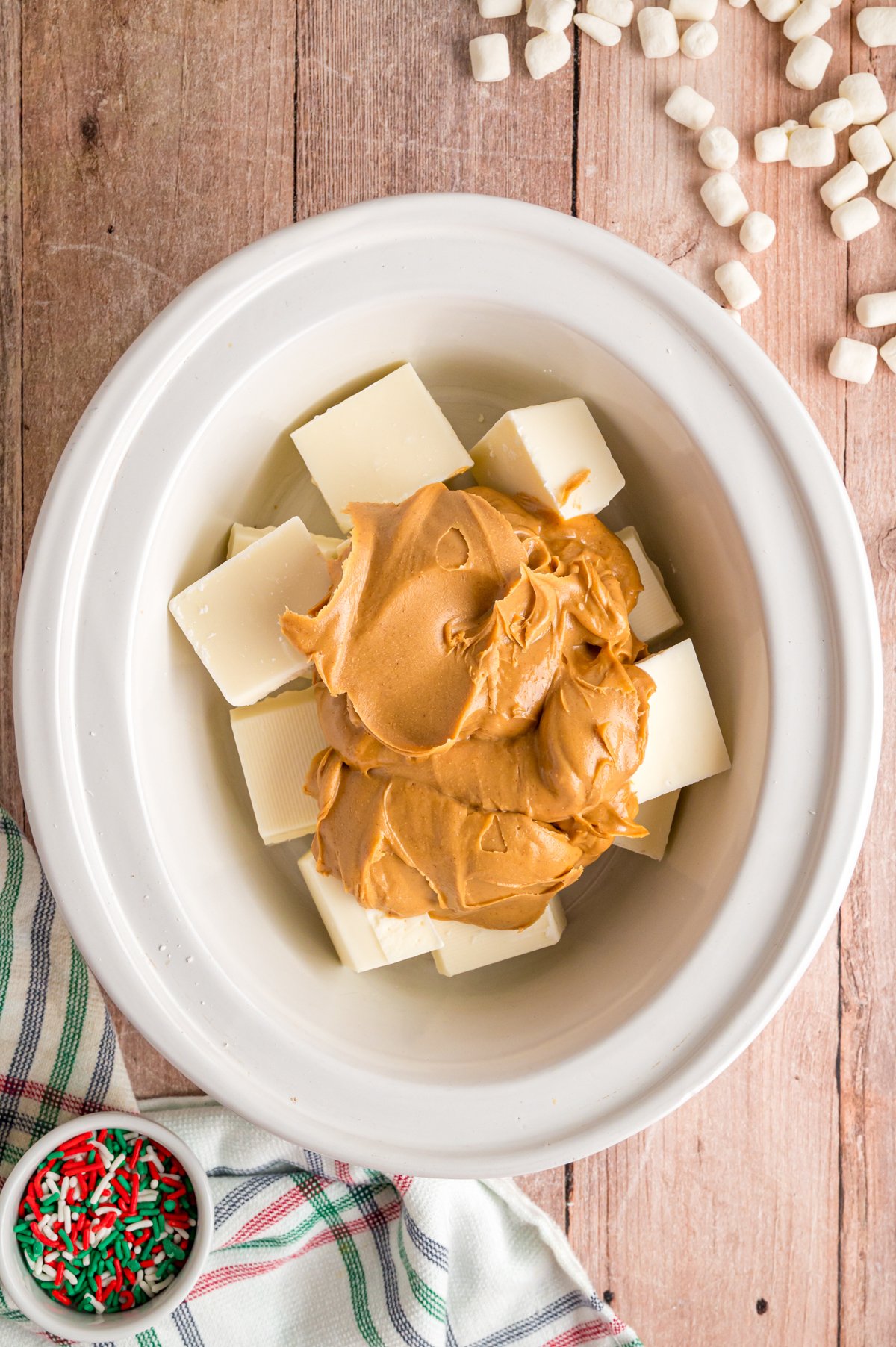 Almond bark and peanut butter in a crockpot.