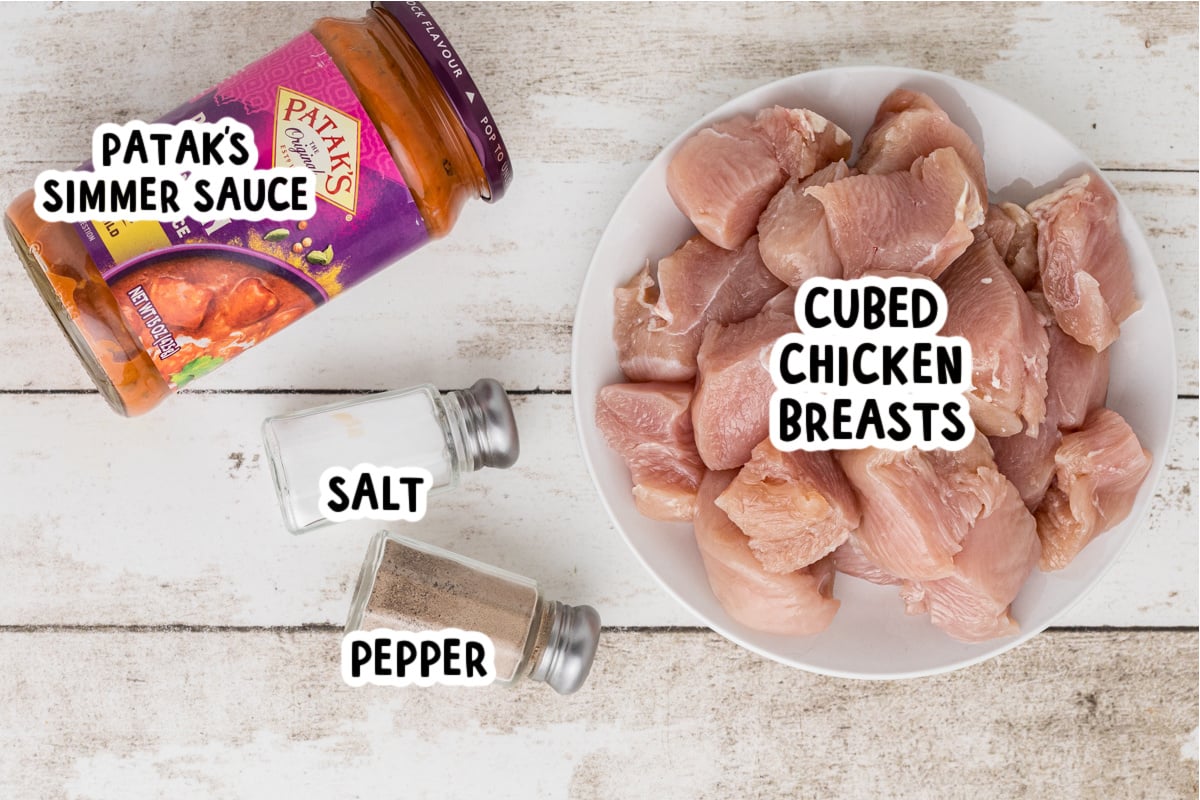 Ingredients for slow cooker chicken curry on a table.