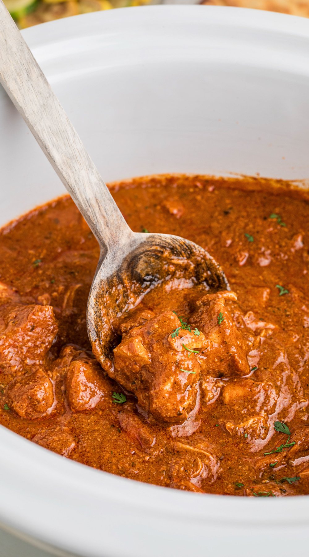 Long image of slow cooker chicken curry.