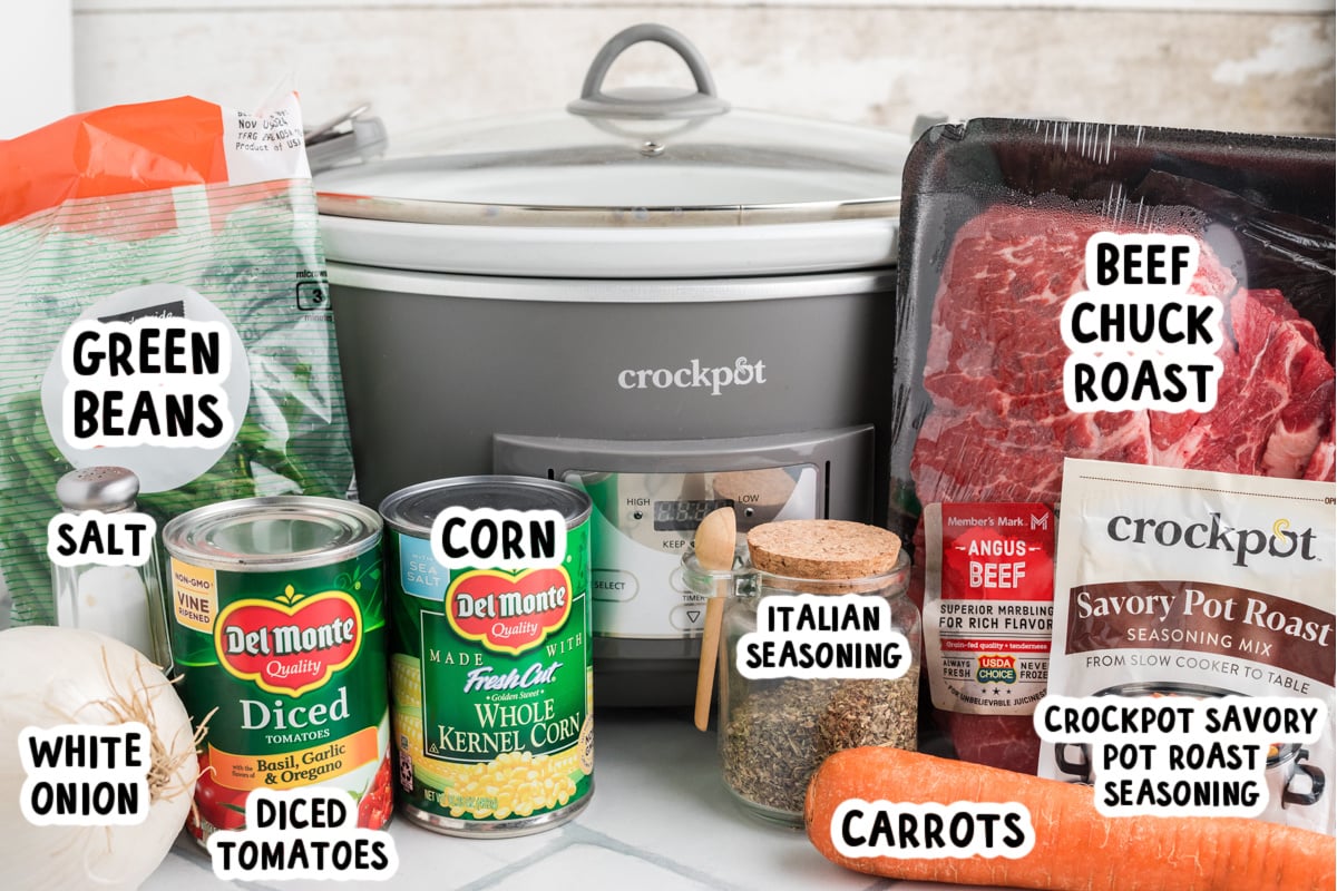 Ingredients for slow cooker shredded beef dinner on a table.