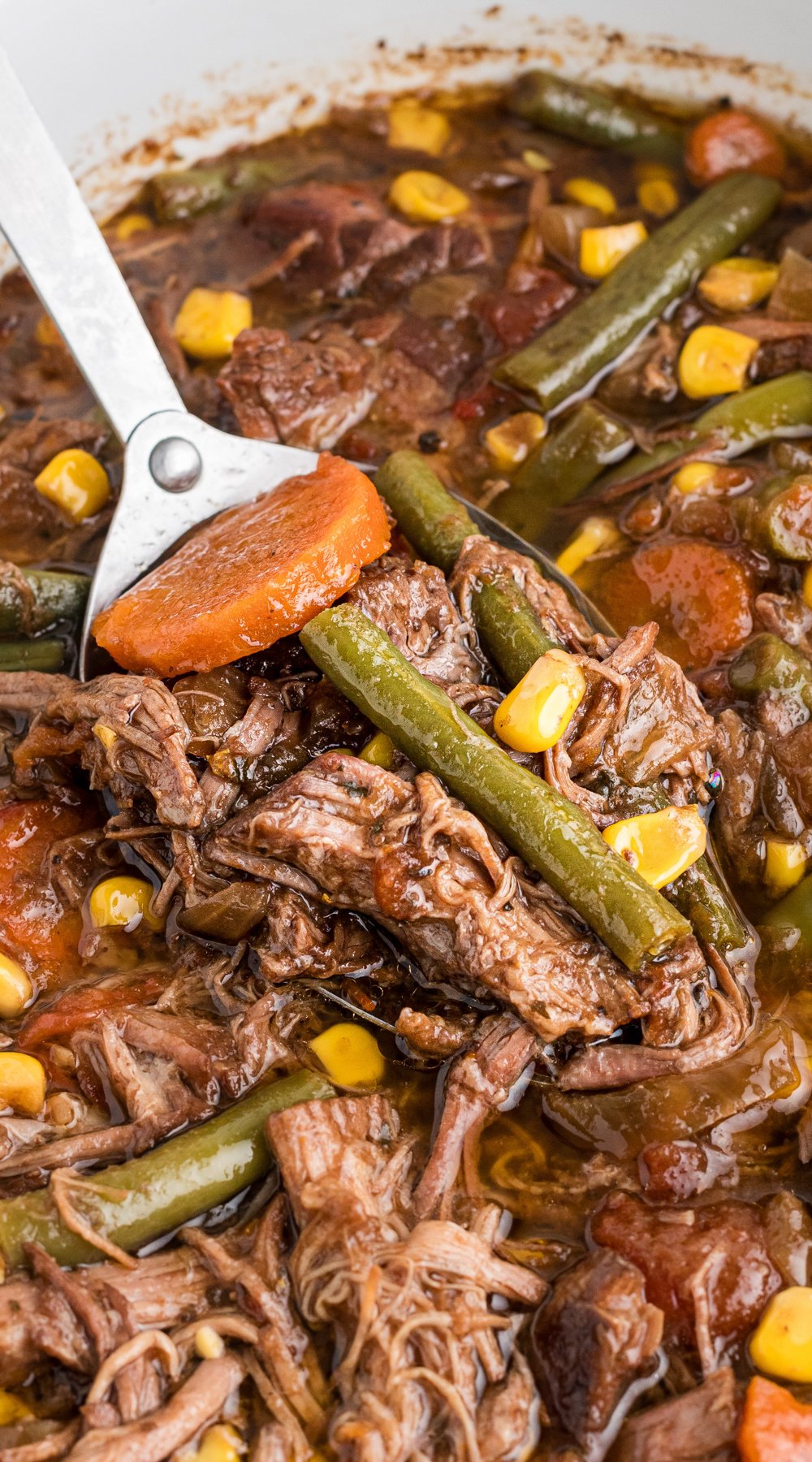 Long image of slow cooker shredded beef dinner.