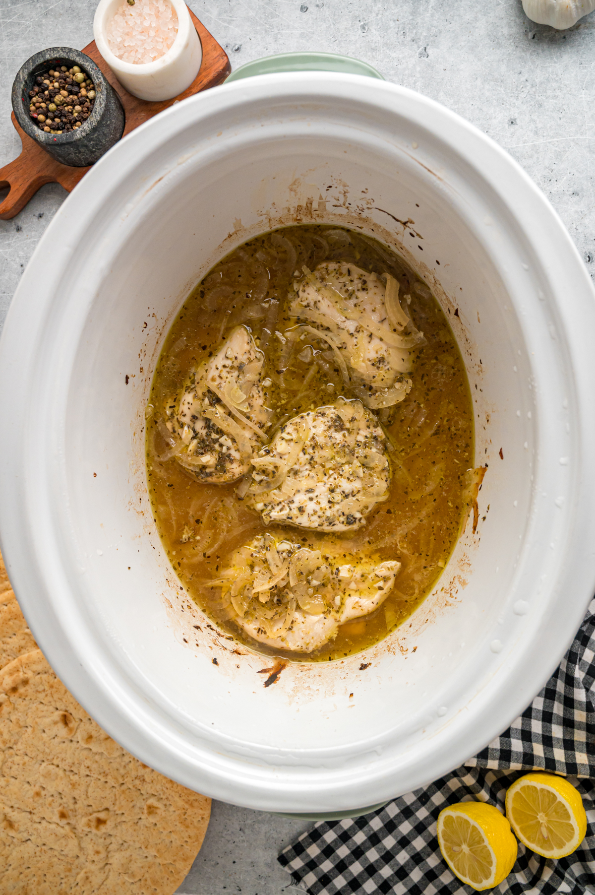 Cooked chicken in a crockpot.