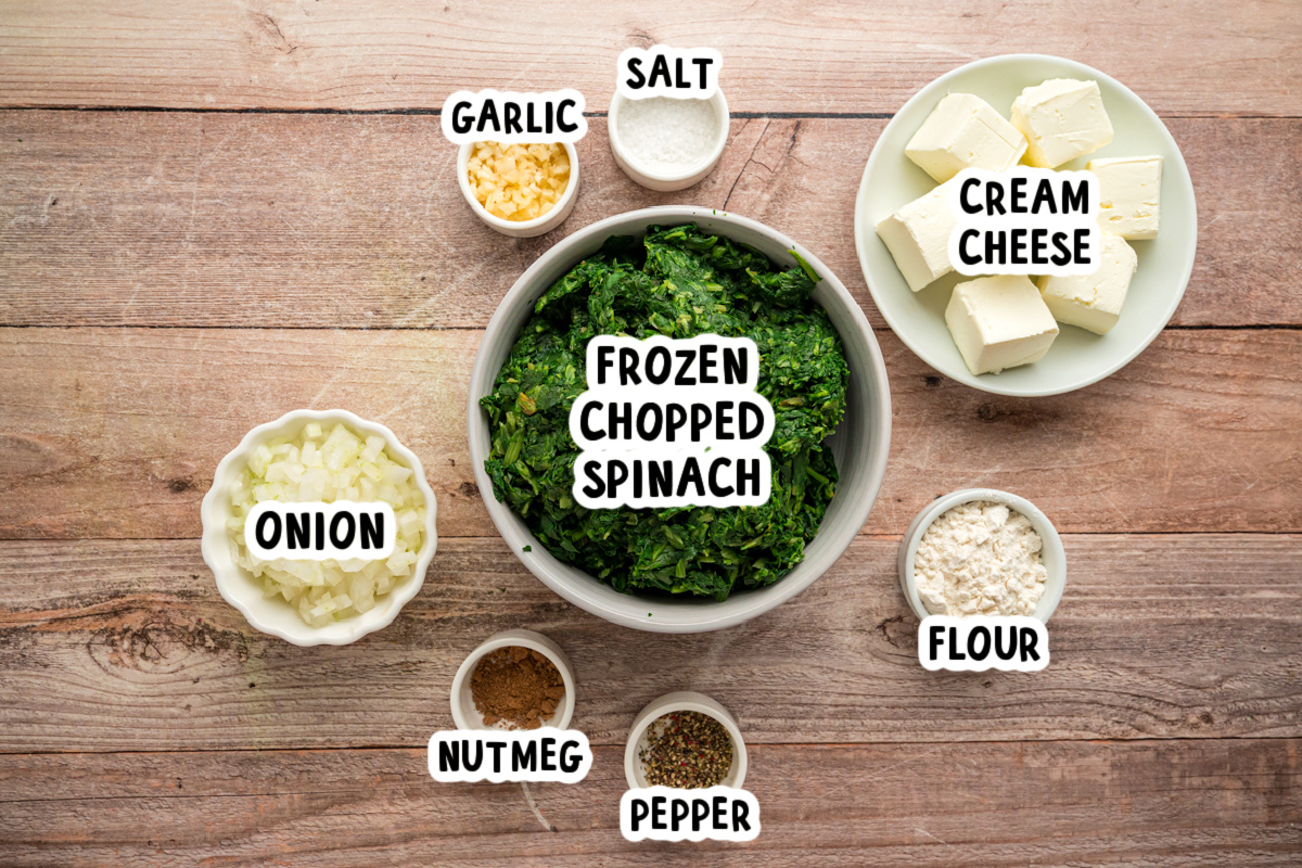 Ingredients for slow cooker creamed spinach on a table.