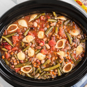 Slow cooker 15 bean minestrone soup with bag of beans in the background.